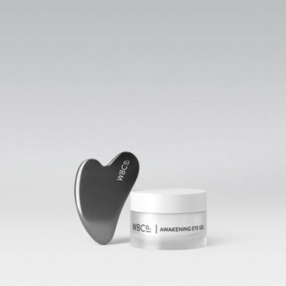 A jar of Awakening Eye Gel with an expensive Gua Sha tool.