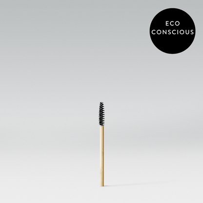 A single bamboo spoolie brush with a label in the upper right corner stating 'ECO CONSCIOUS'.