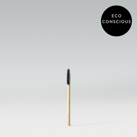A single bamboo spoolie brush with a label in the upper right corner stating 'ECO CONSCIOUS'.