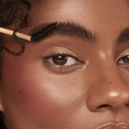 Brow spoolie bent, on black womens face grooming the brow. black beauty. brow styling 
